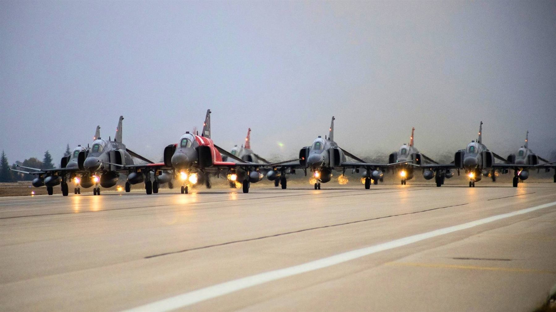 Military aircraft prepared for operations on a runway