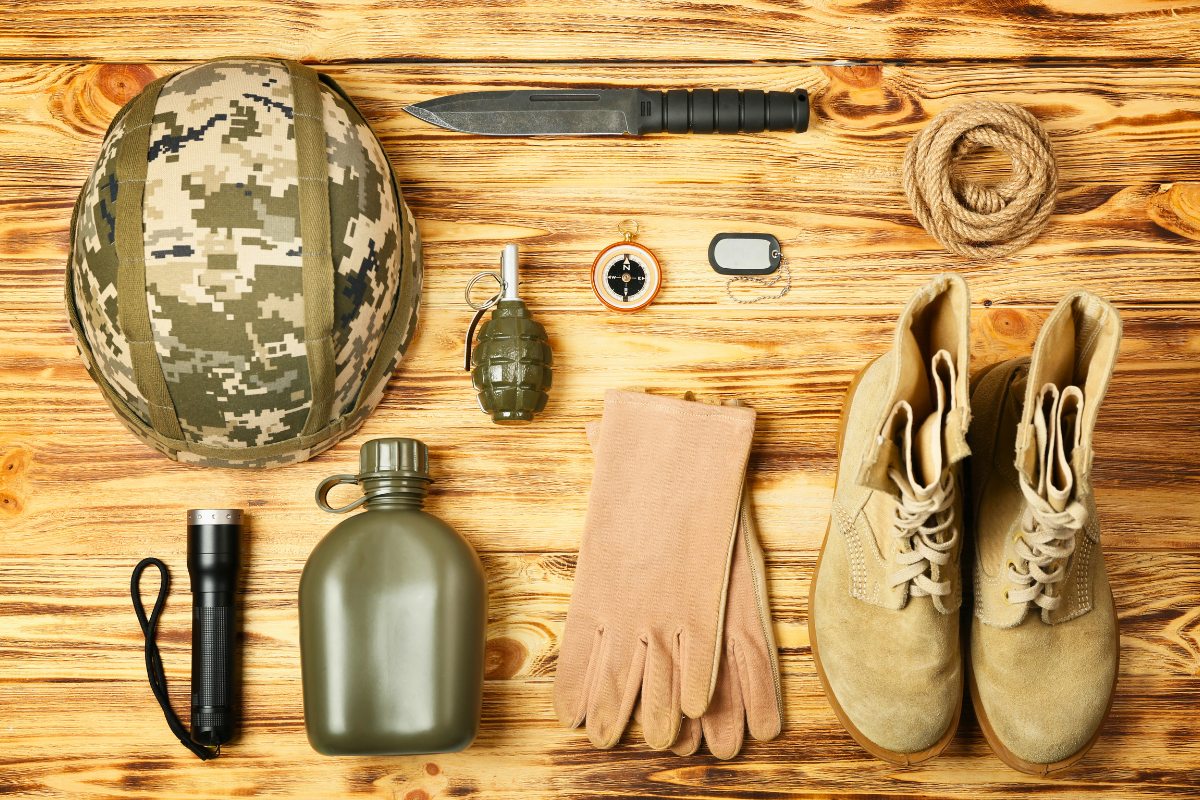 Field kit including helmet, canteen, compass, knife and boots